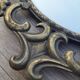 2 antique oval mirrors in heavy metal