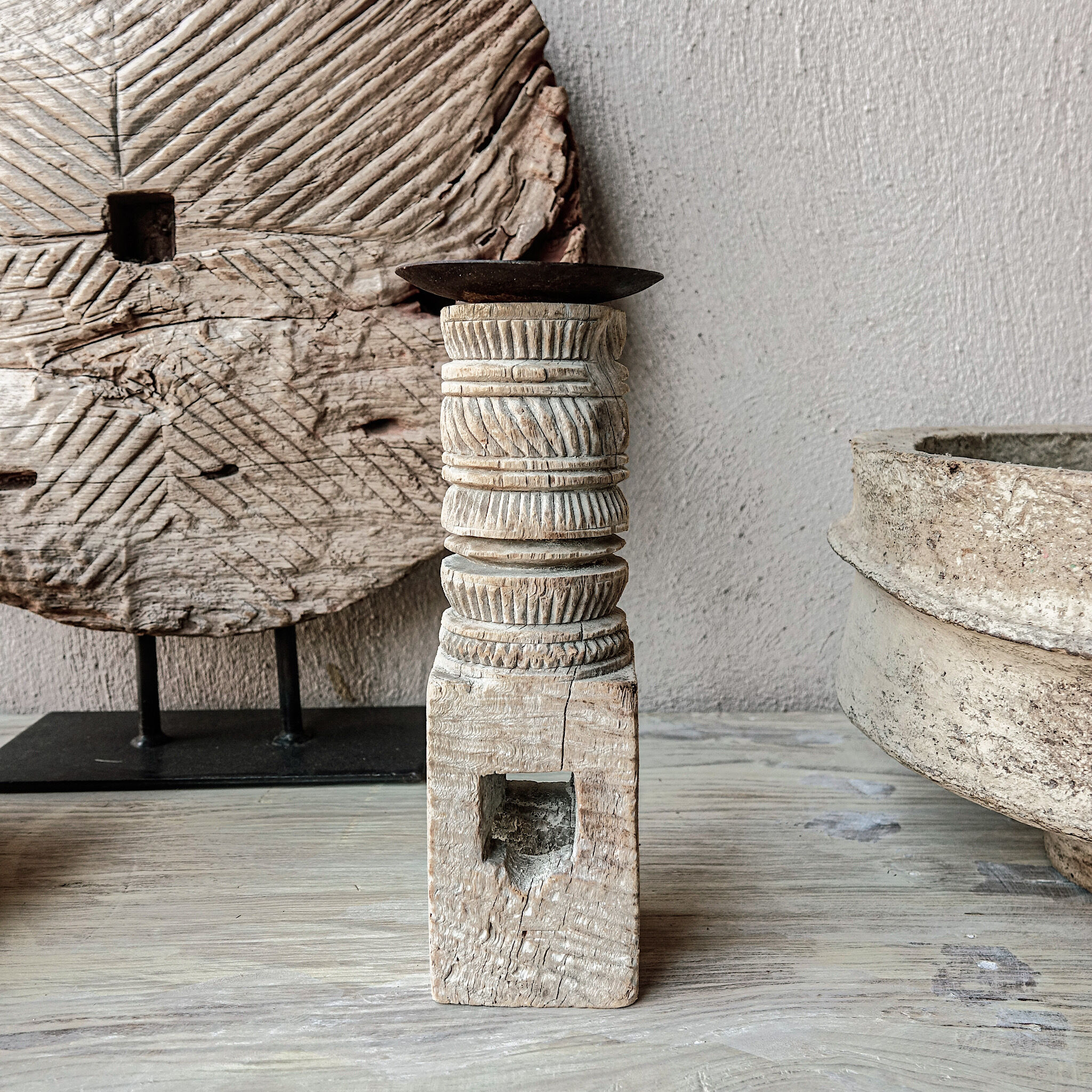 Candle holder in light carved wood