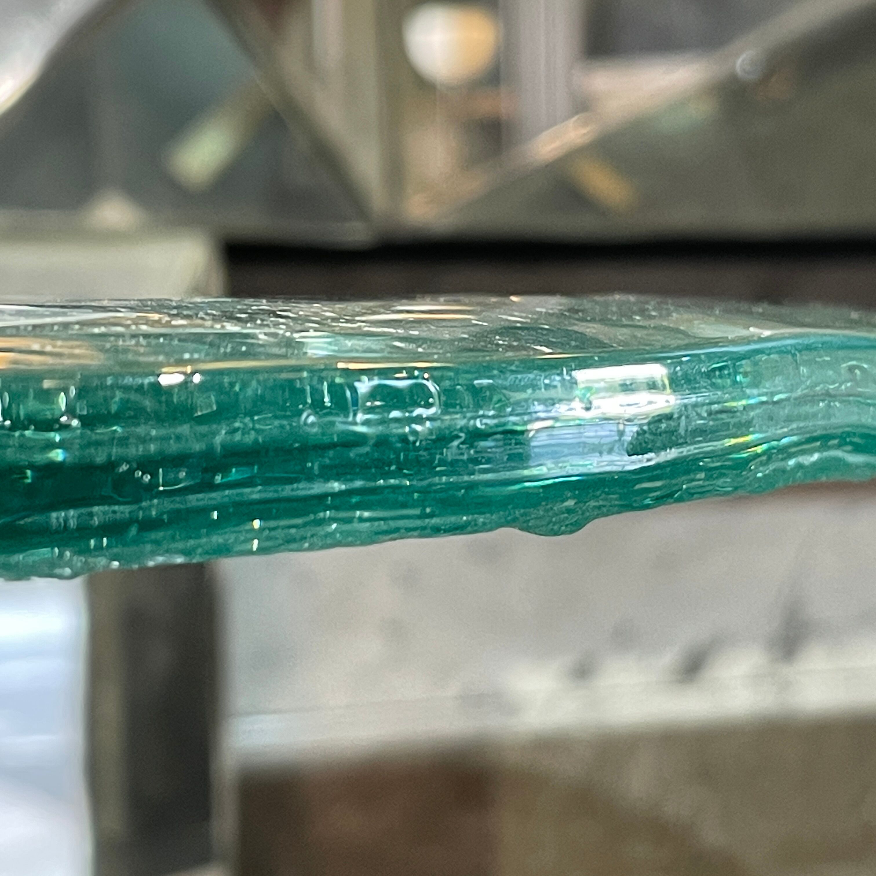 Pair of round coffee tables, glass, ca 1970