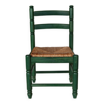 Vintage children's chair in green wood with a woven straw seat