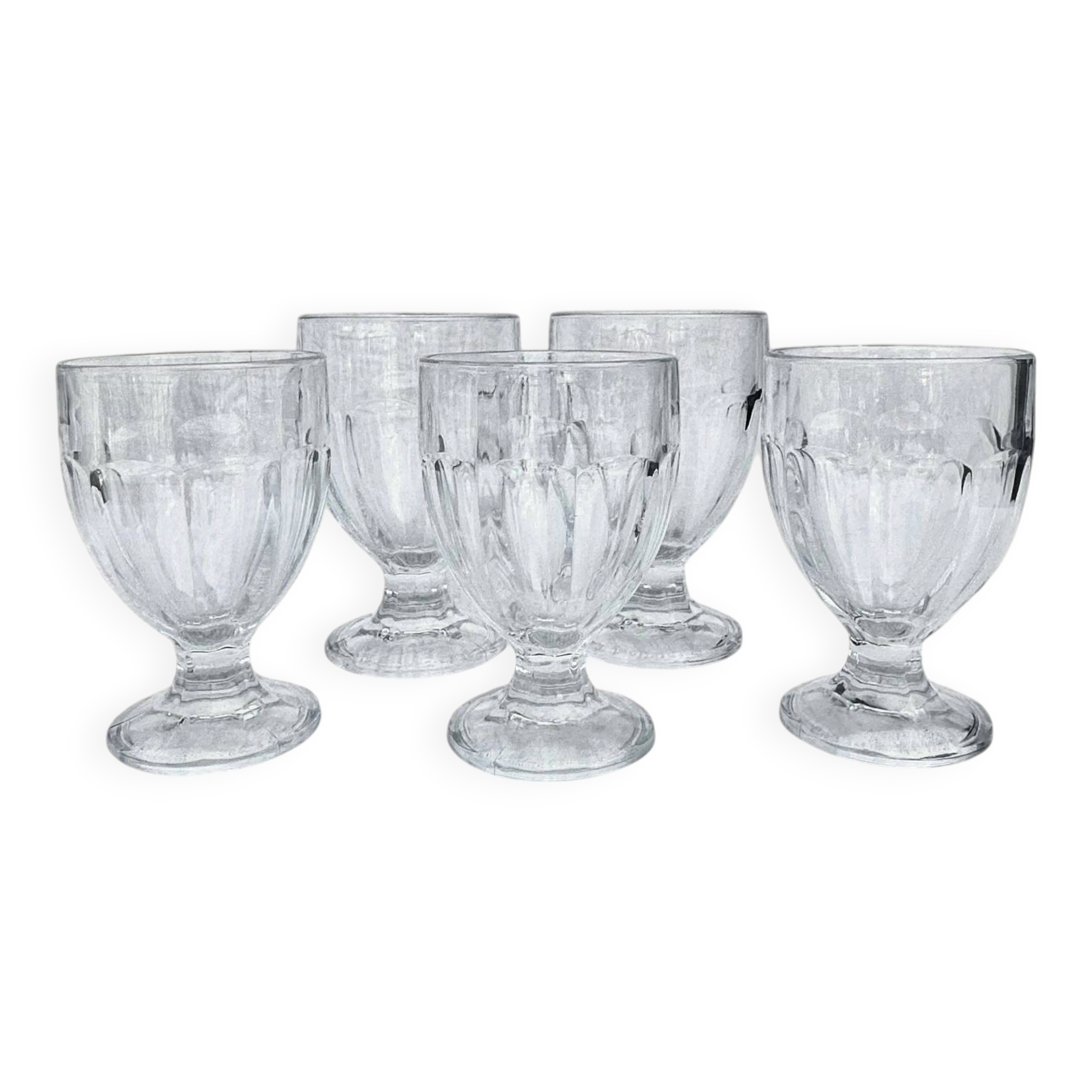 Set of 5 stemmed glasses made of pressed moulded glass.