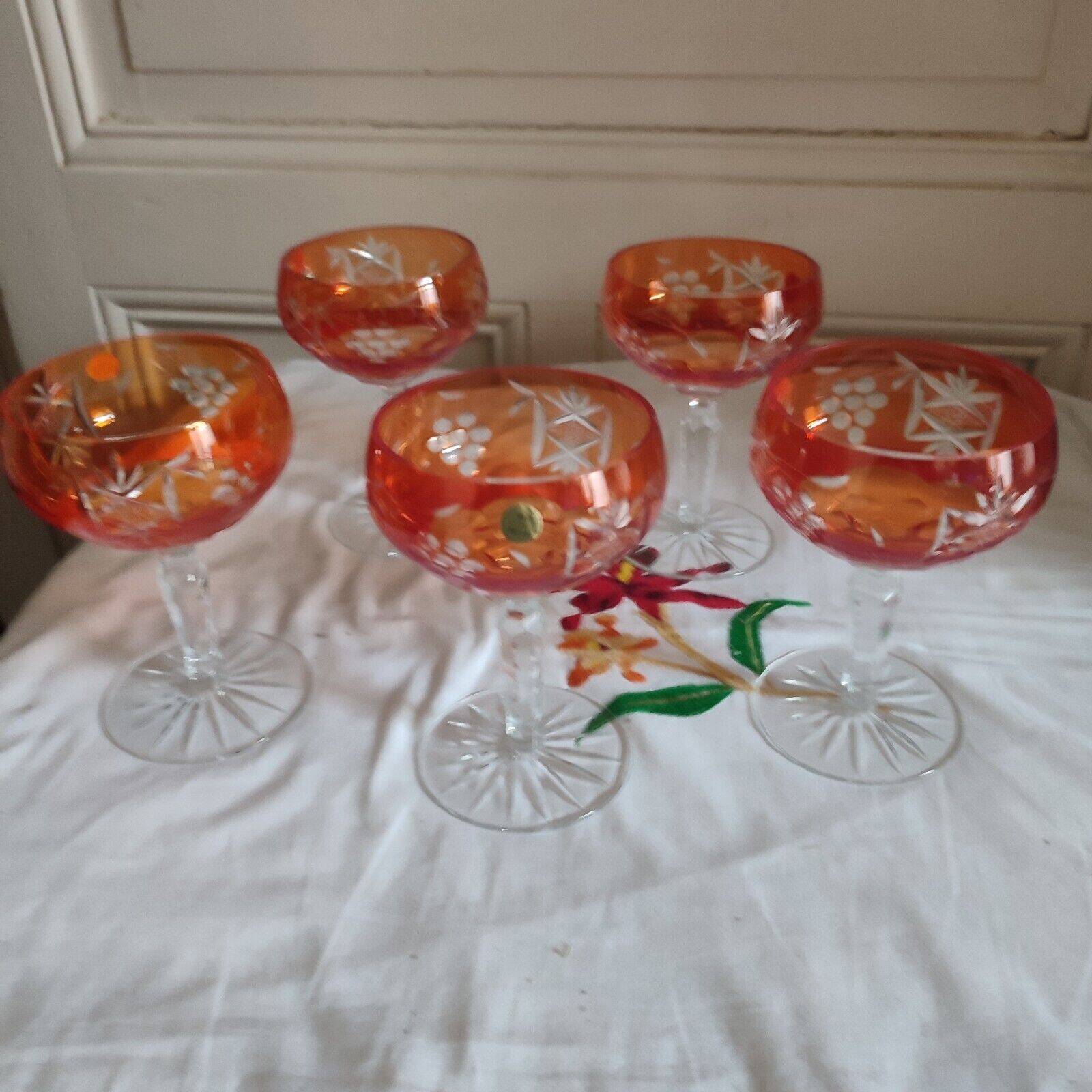 Five antique orange cut crystal champagne glasses with grape cluster decoration Poland