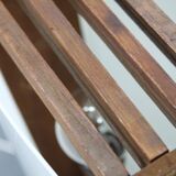 Mid-century modern floor lamp on iron legs with plastic shade and wood accent