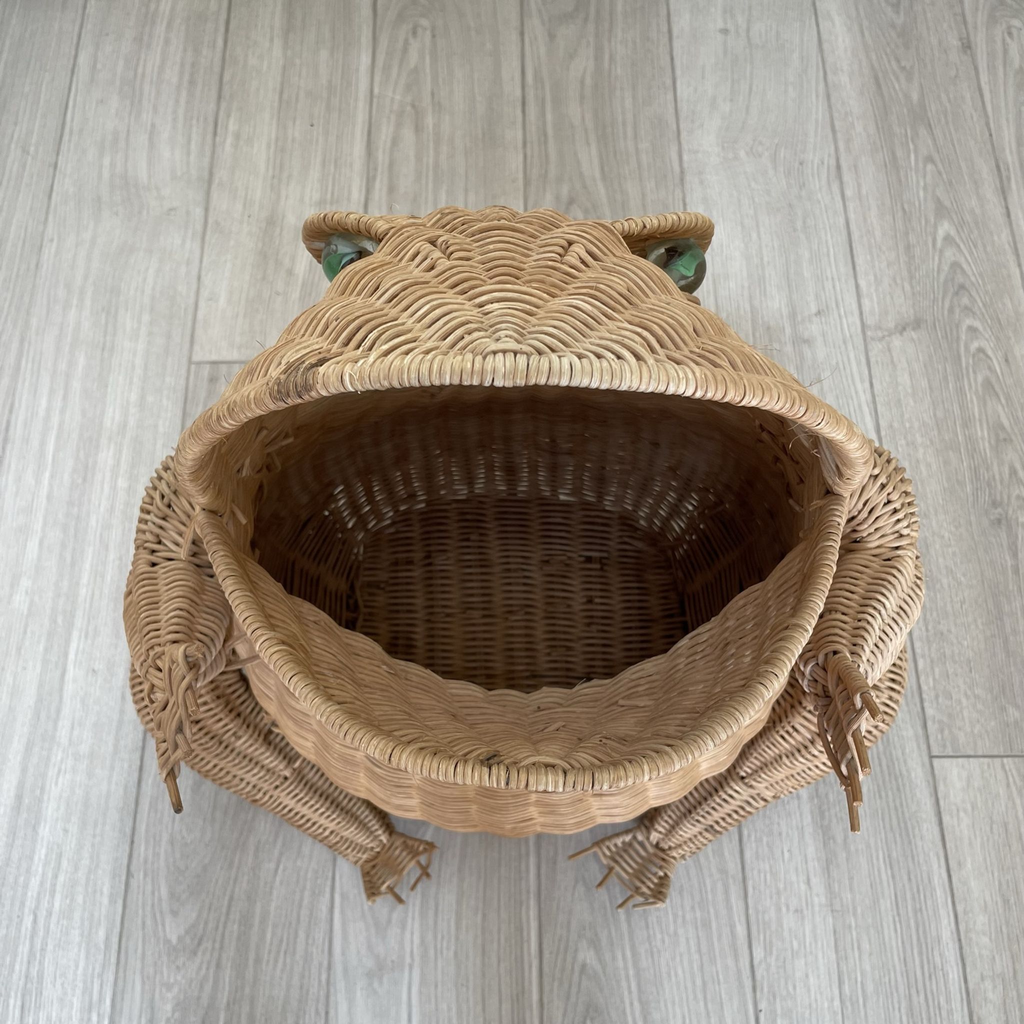Wicker frog magazine holder by Olivier Cajan