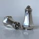 Antique salt and pepper shakers in solid English silver
