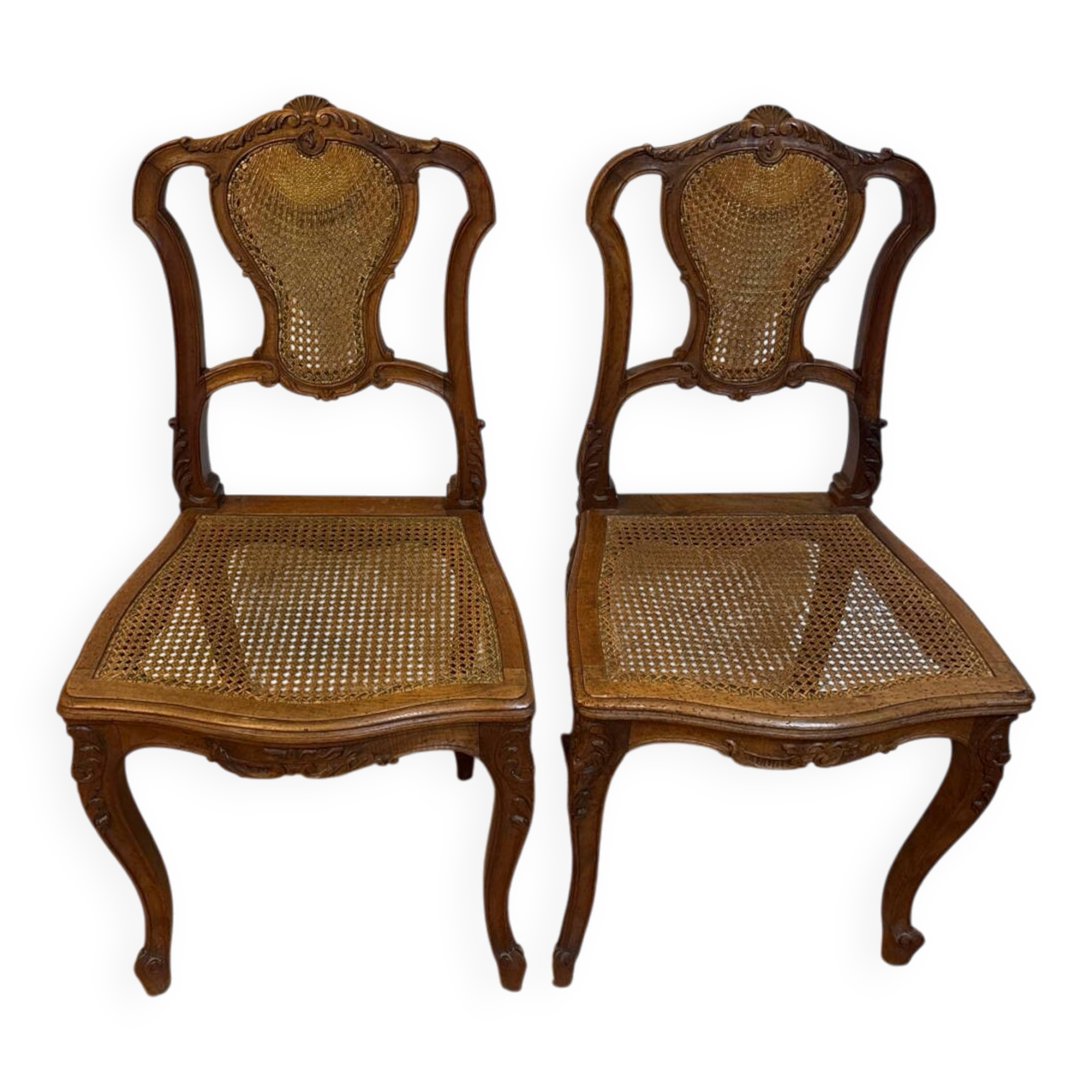 Pair of Louis XV style chairs in wood and caning.
