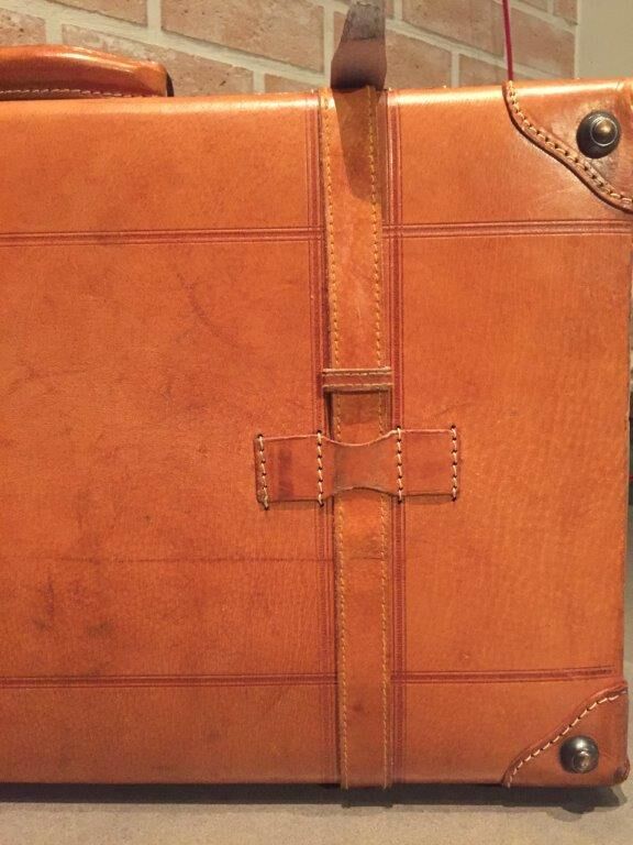 Thick leather suitcase