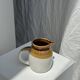 Small two-tone white and brown pitcher Made in China