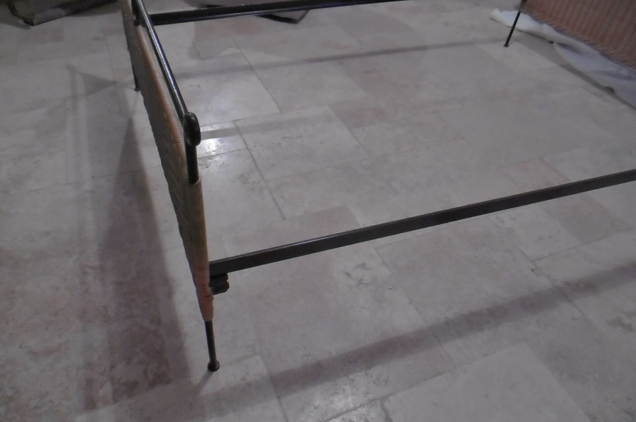 Black metal and rattan bed frame