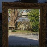 Wooden mirror decorated with gold from the 1920s