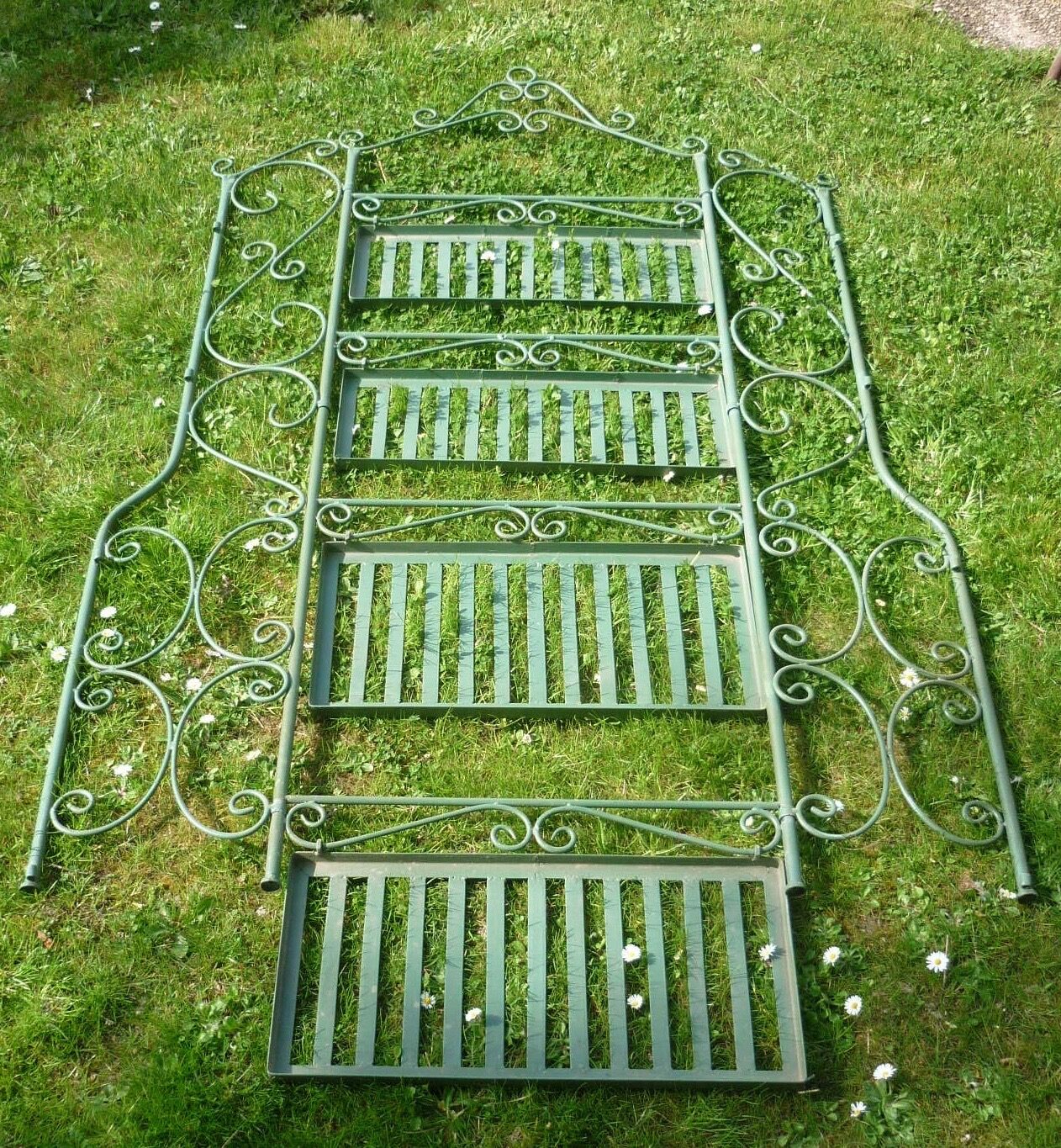 Folding green wrought iron shelf