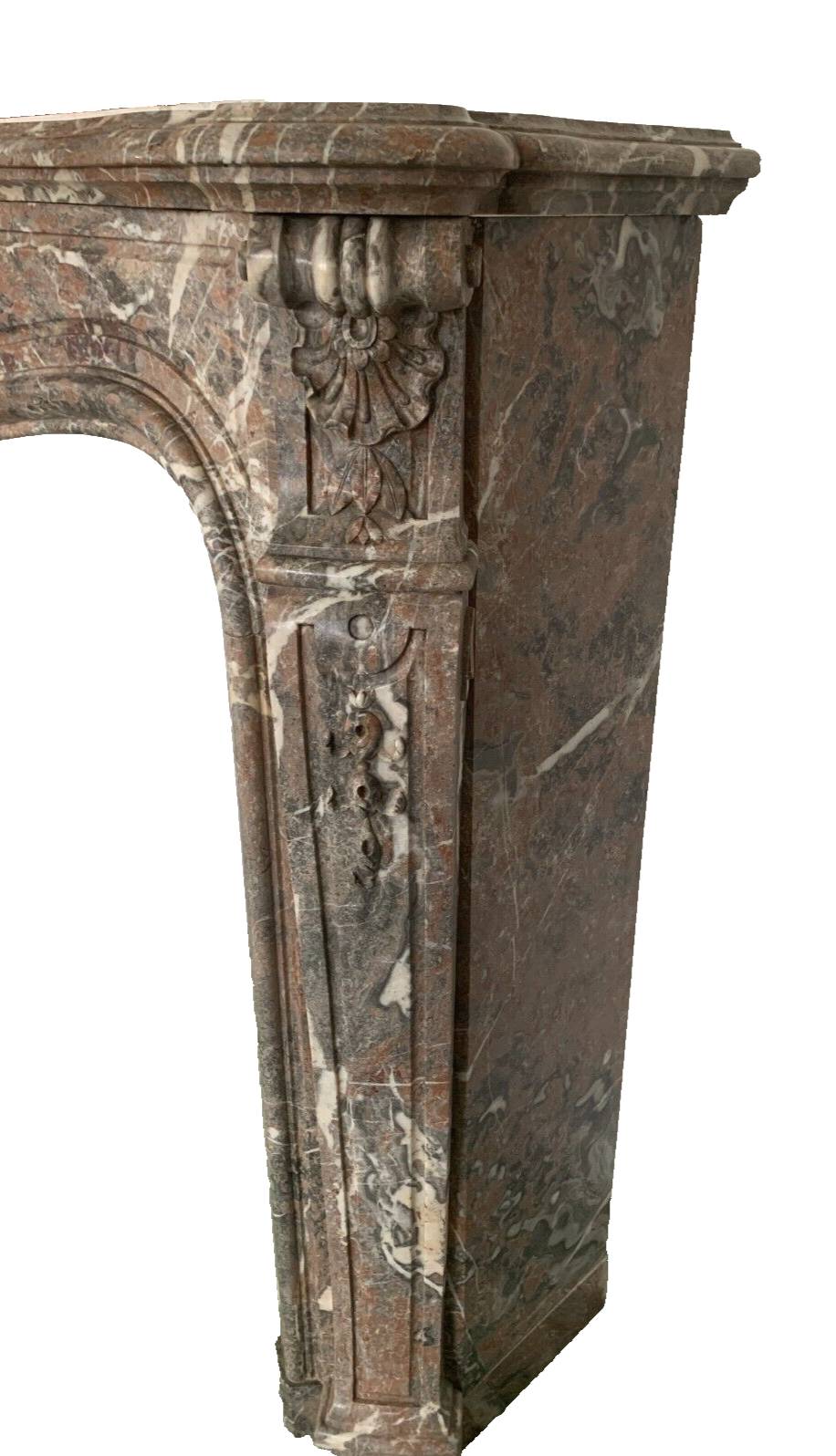 Louis XV style fireplace in red breche marble 19th century