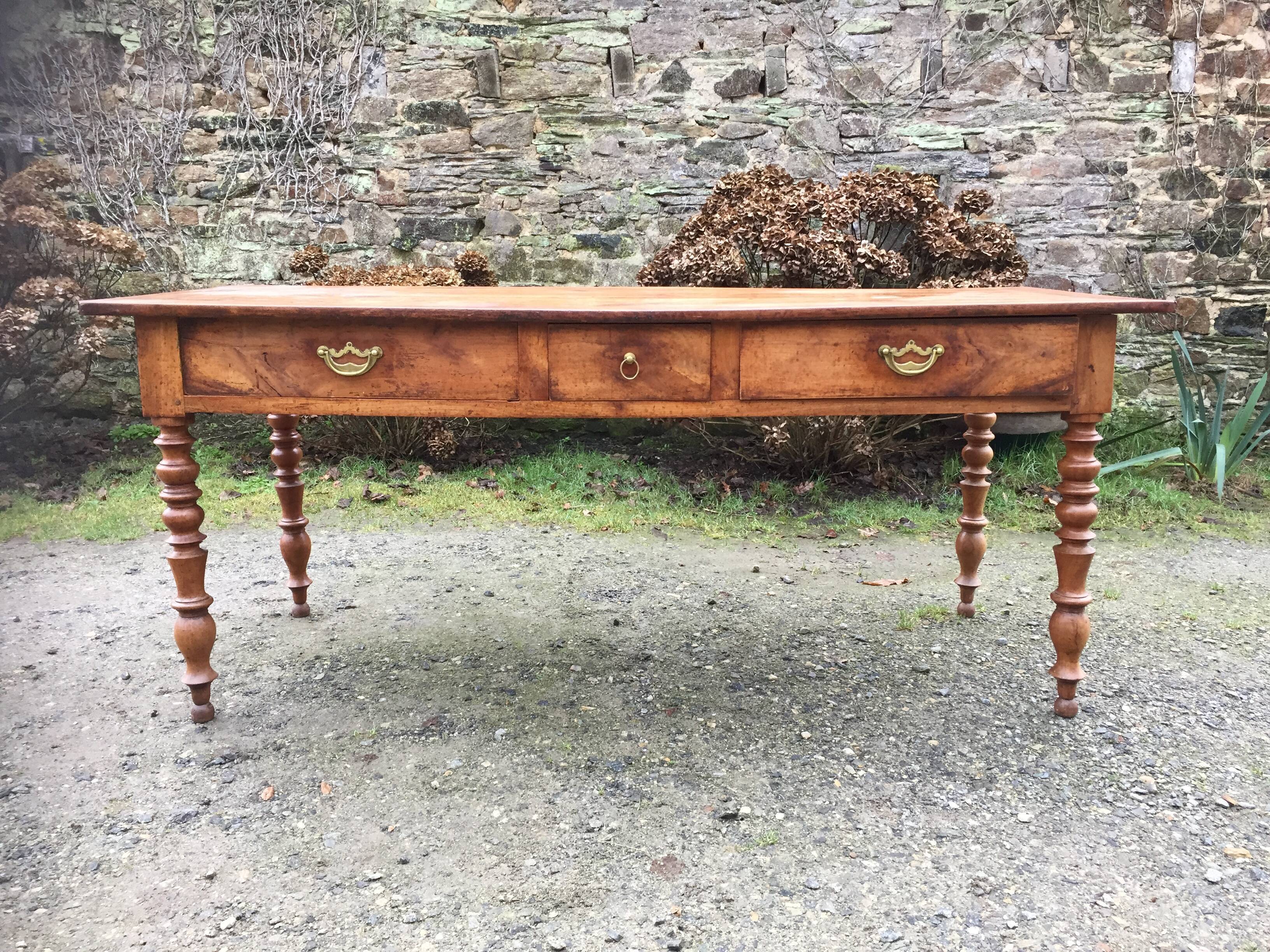 Old cherry farmhouse table with 3 drawers and turned legs