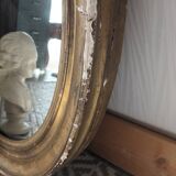 Antique oval gilded stucco mirror