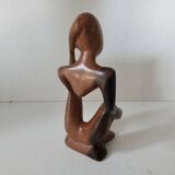 Wooden statuette sculpture of a thinking man design