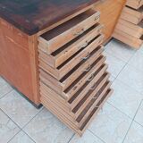 Workshop furniture with drawers and curtain in beech and walnut.