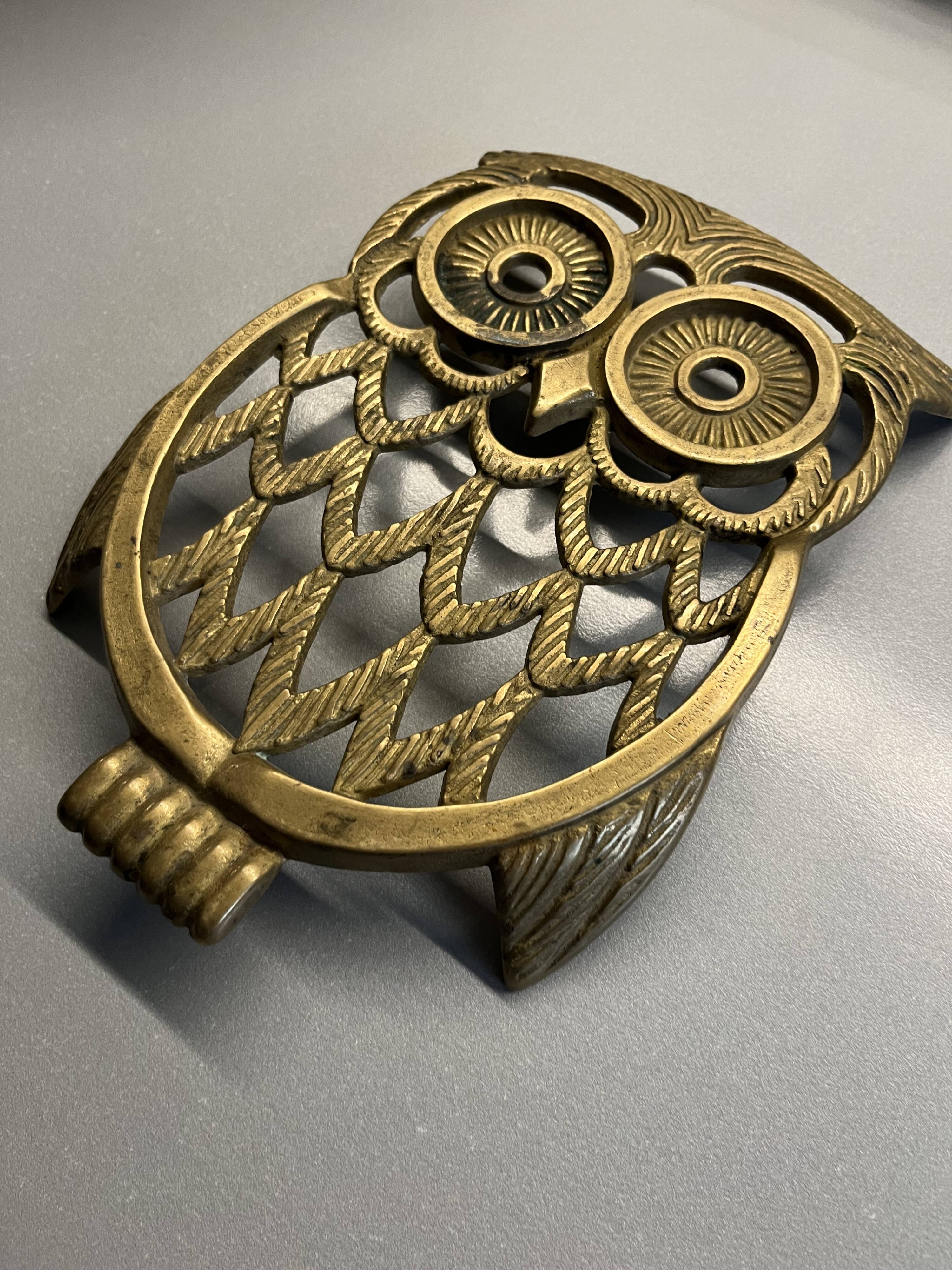 Old brass owl table mat