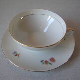 Old large tea cup and saucer in Limoges porcelain with flower decor