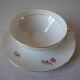 Old large tea cup and saucer in Limoges porcelain with flower decor