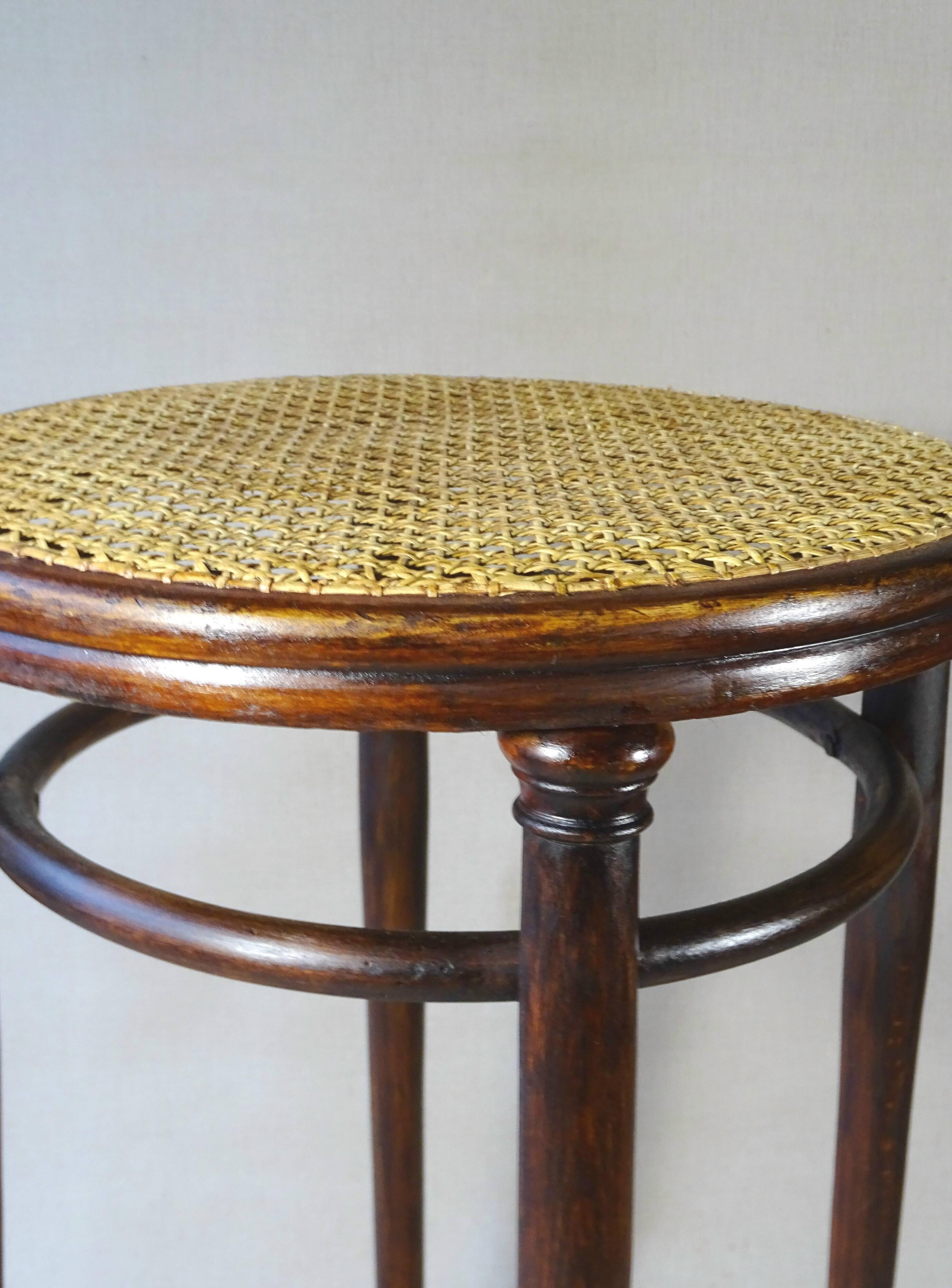 Stool: Bentwood, by Fischel around 1900, caned.