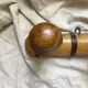 Antique wall-mounted coat rack in turned bamboo-style wood