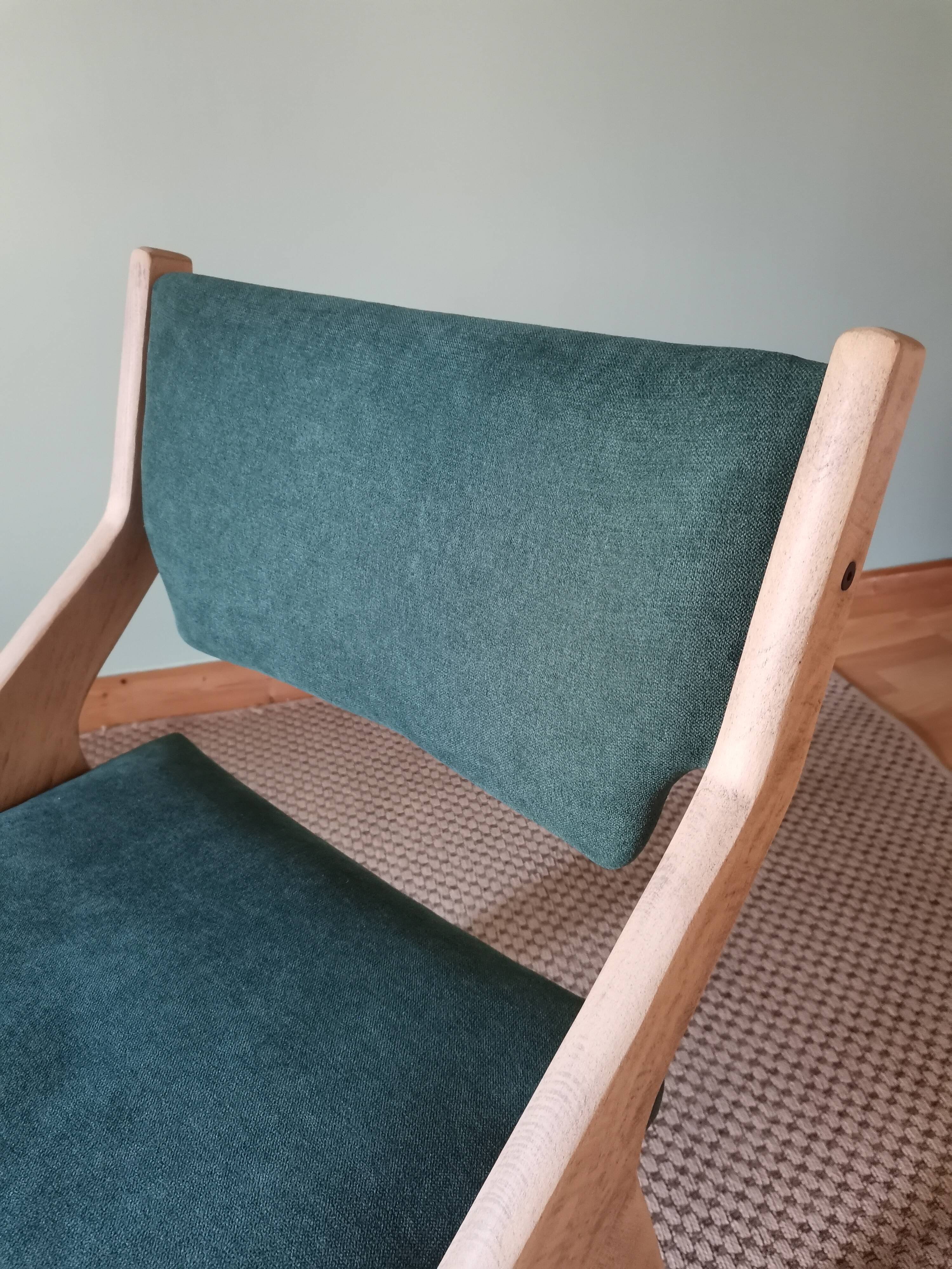 Scandinavian green chairs with tapered legs.