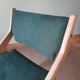 Scandinavian green chairs with tapered legs.