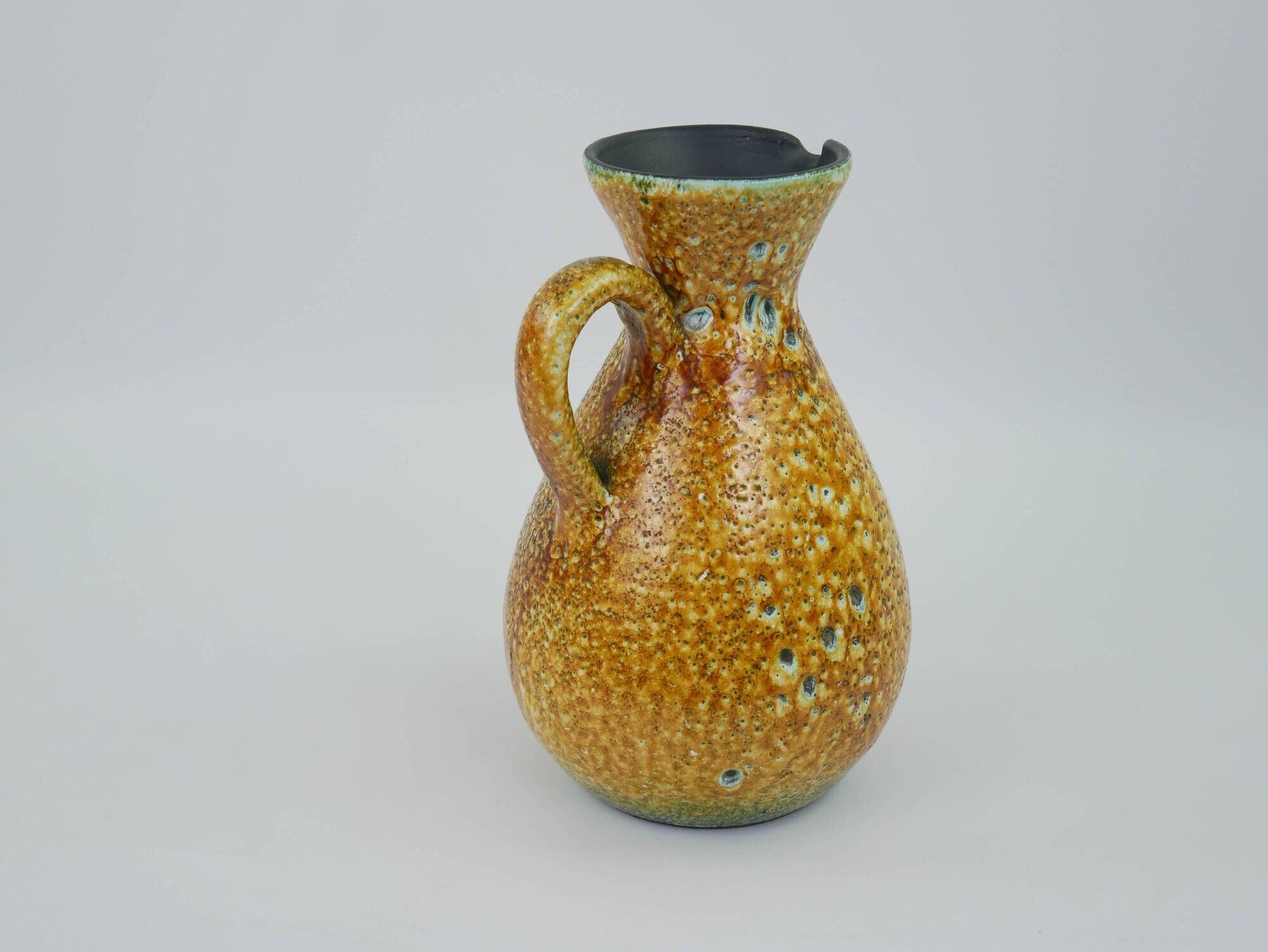 Large yellow ceramic pitcher in the Accolay style