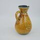 Large yellow ceramic pitcher in the Accolay style