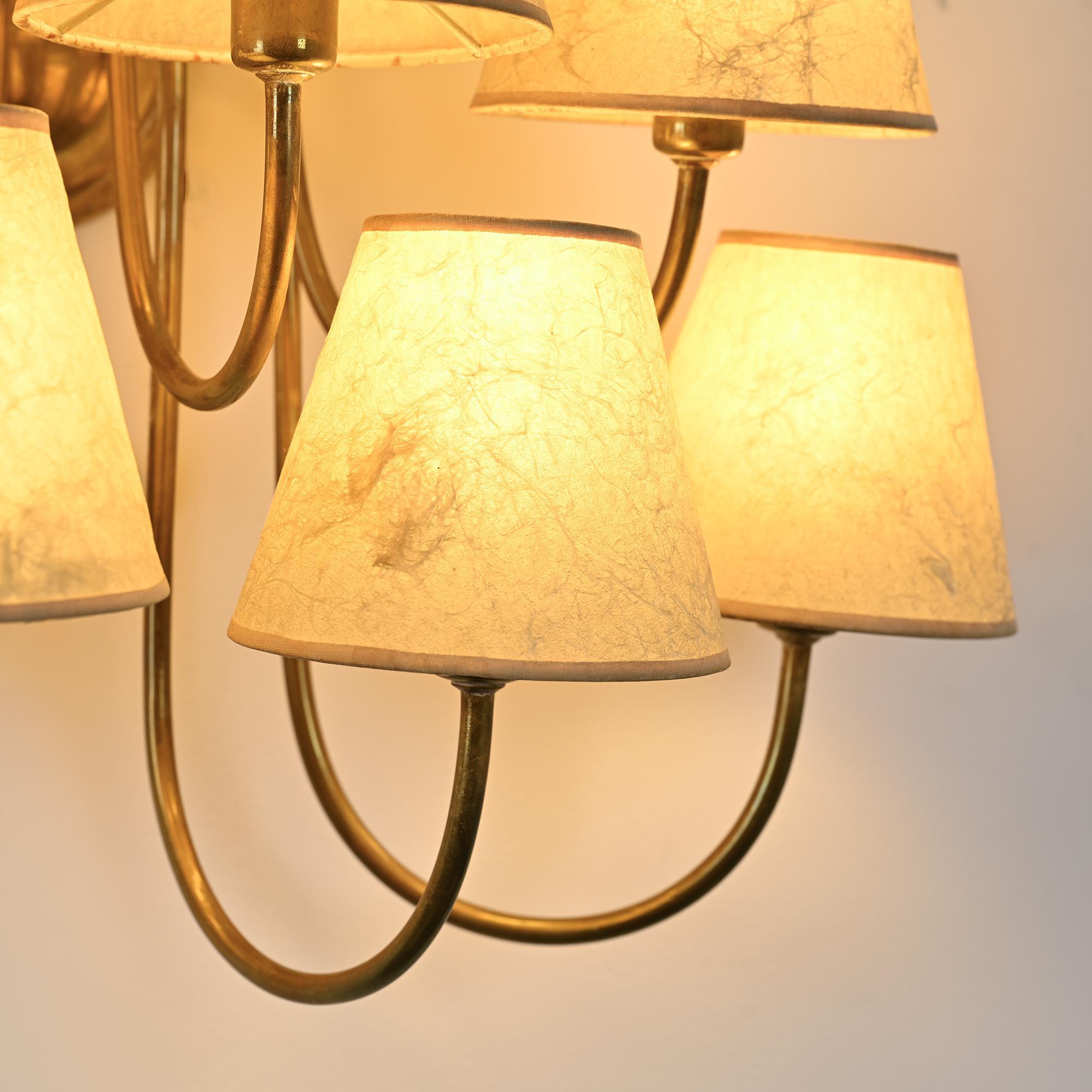 Wall sconce with nine arms in brass, France, circa 1950.