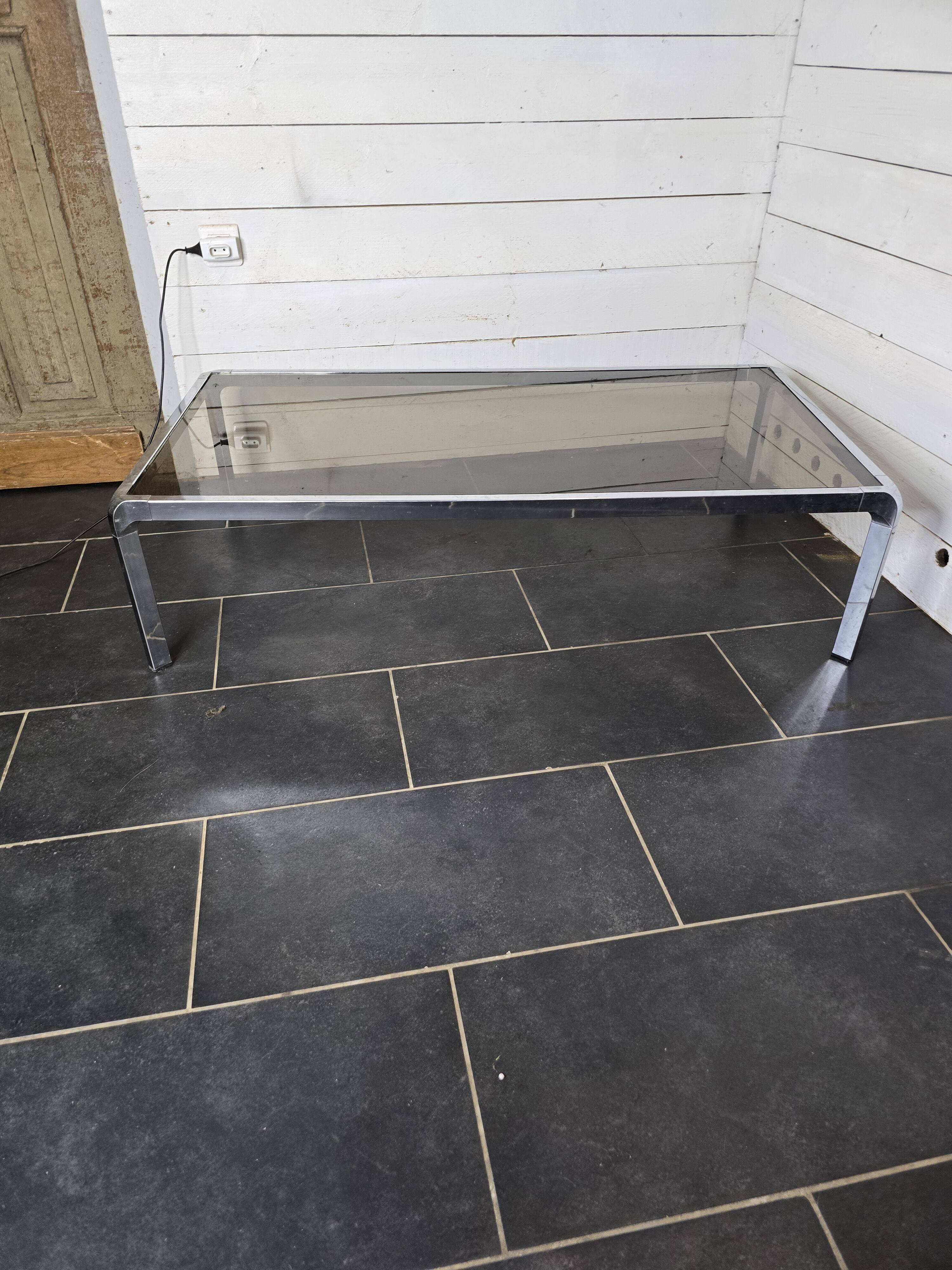 Chromed metal coffee table with smoked glass top from the 70s