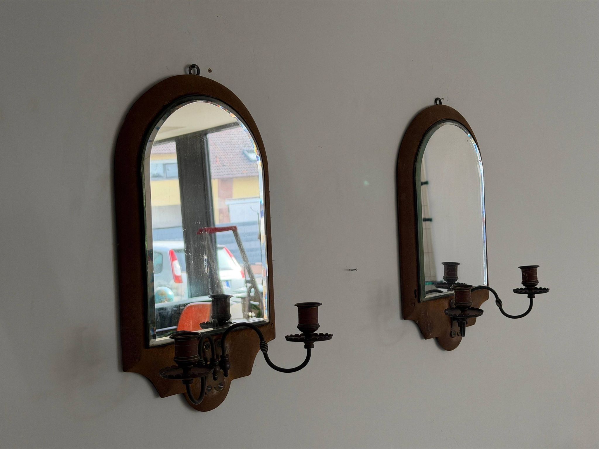 Pair of brass double-headed candlesticks with mirrors, 1940s, Italy