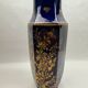 Octagonal vase in Limoges porcelain, oven blue and gold decoration, 20th century