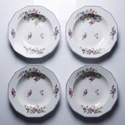 4 flat plates by Bernardaud, Limoges porcelain, floral decoration from the 1920s to 1950s.