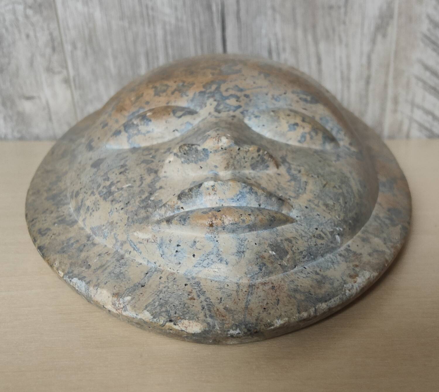 African stone face sculpture