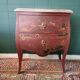 French XIX jumping chest of drawers in Chinese lacquer ox and golden blood