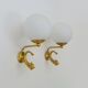 Old pair of wall sconces with carp, brass and globe in white opaline. Year 60