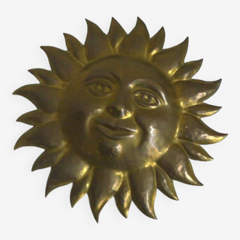 Hanging sun in gold metal