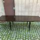 Scandinavian extendable dining table made of solid wood and rosewood effect.