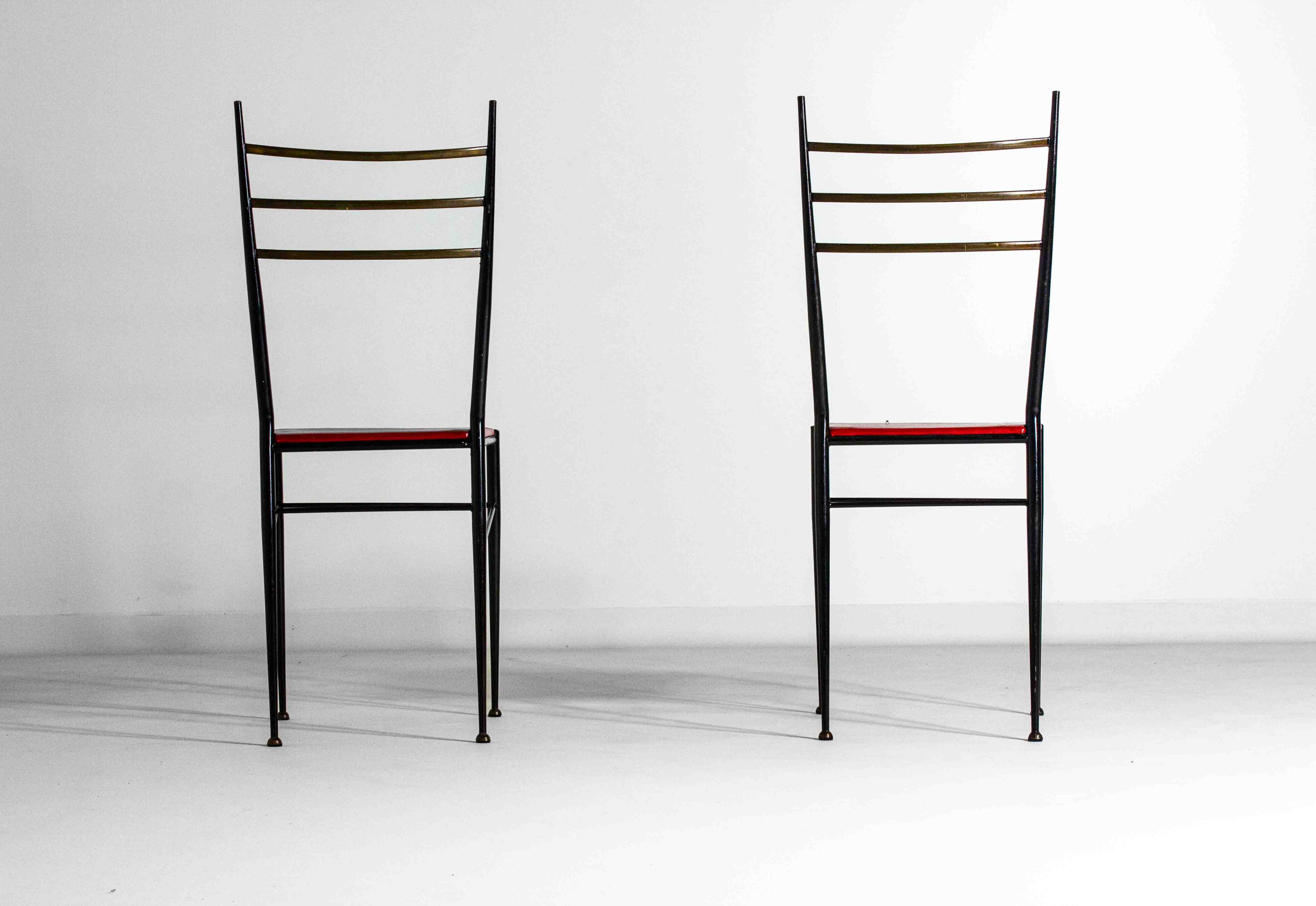 Fine set of metal dining chairs with red leather seating, Italy 1970s