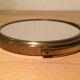 Vintage magnifiing gold round barber mirror