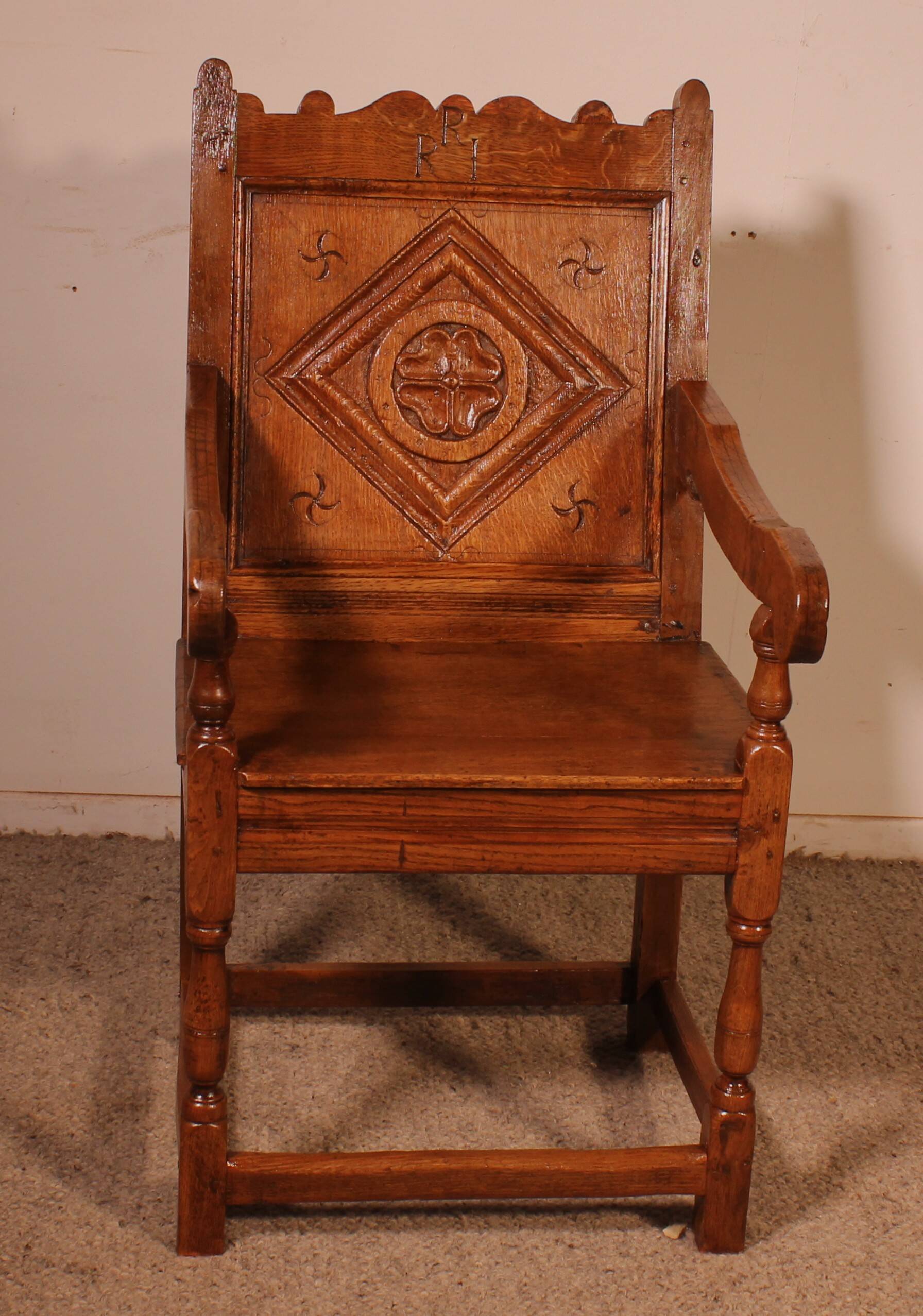 high-backed armchair from the 17th century in oak