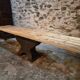 Old French industrial table with a cast iron base and a pine top.