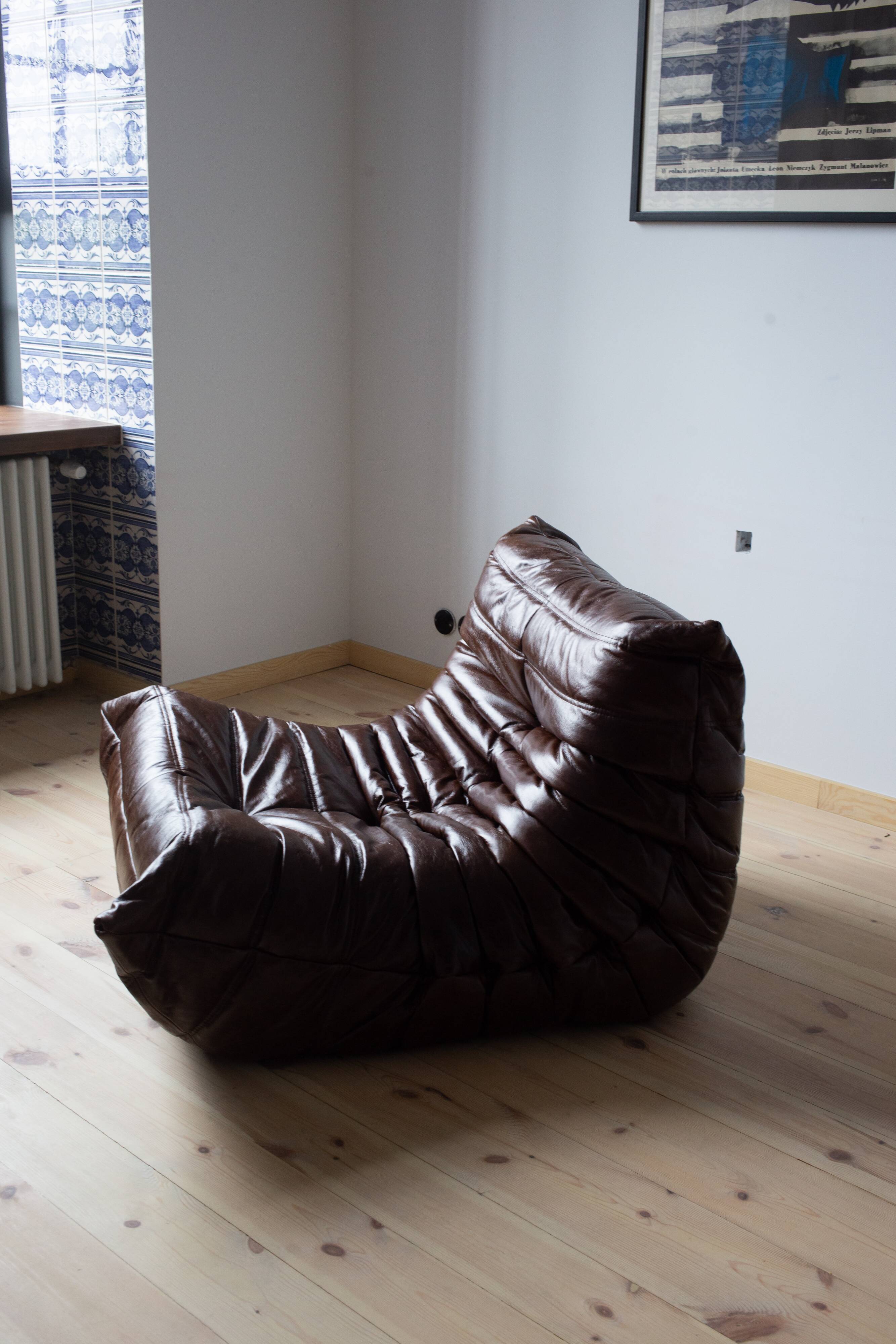 Togo armchair in dark brown shiny leather