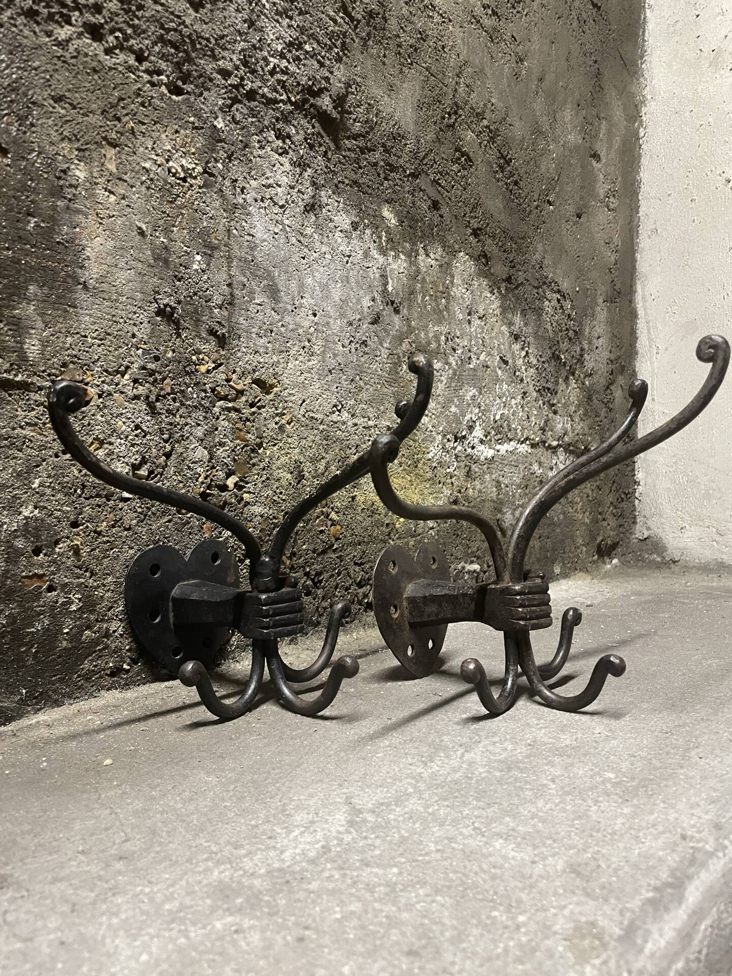 Brutalist pair of wall-mounted coat hooks.