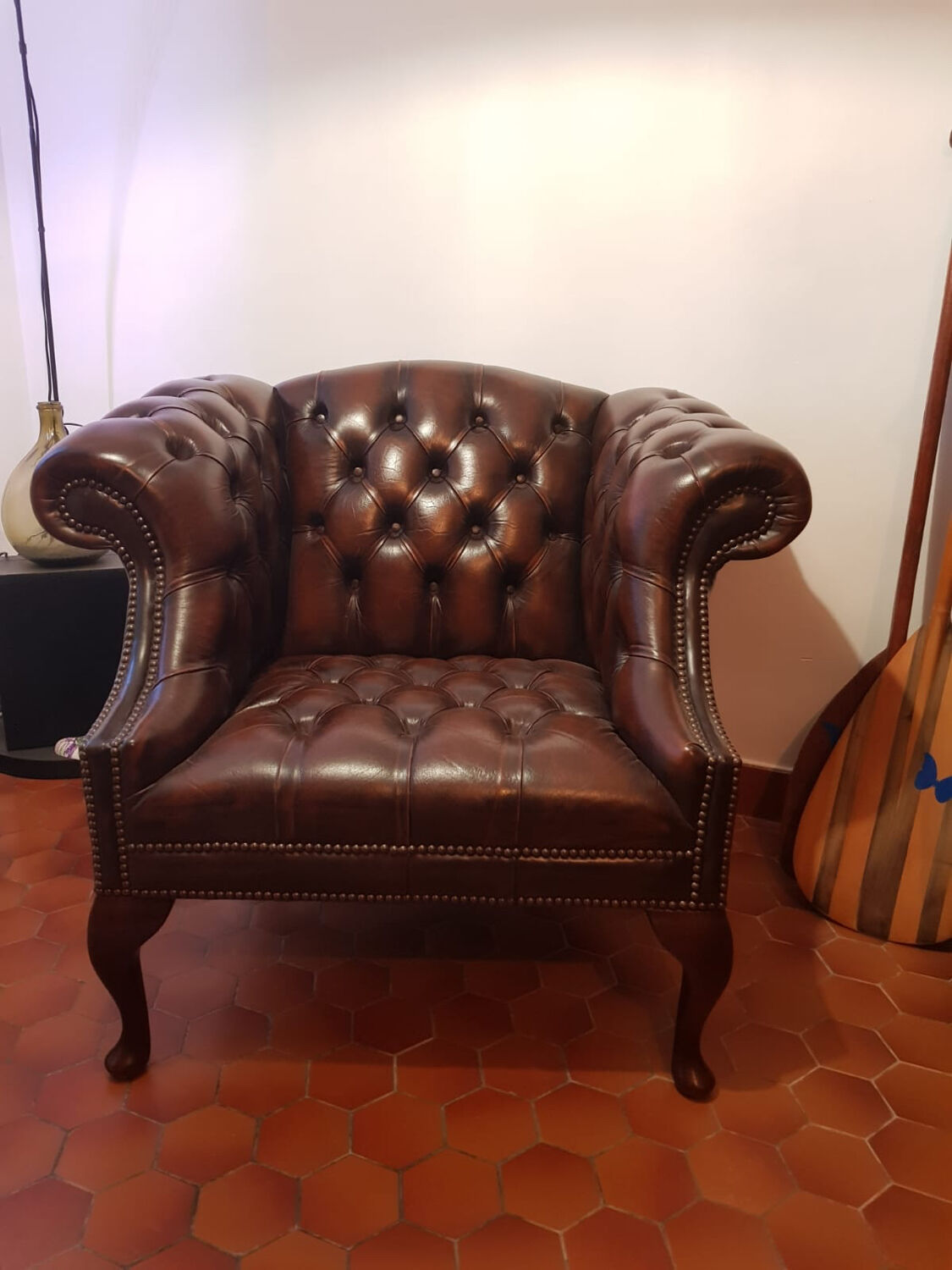 Pair of leather Chesterfield armchairs