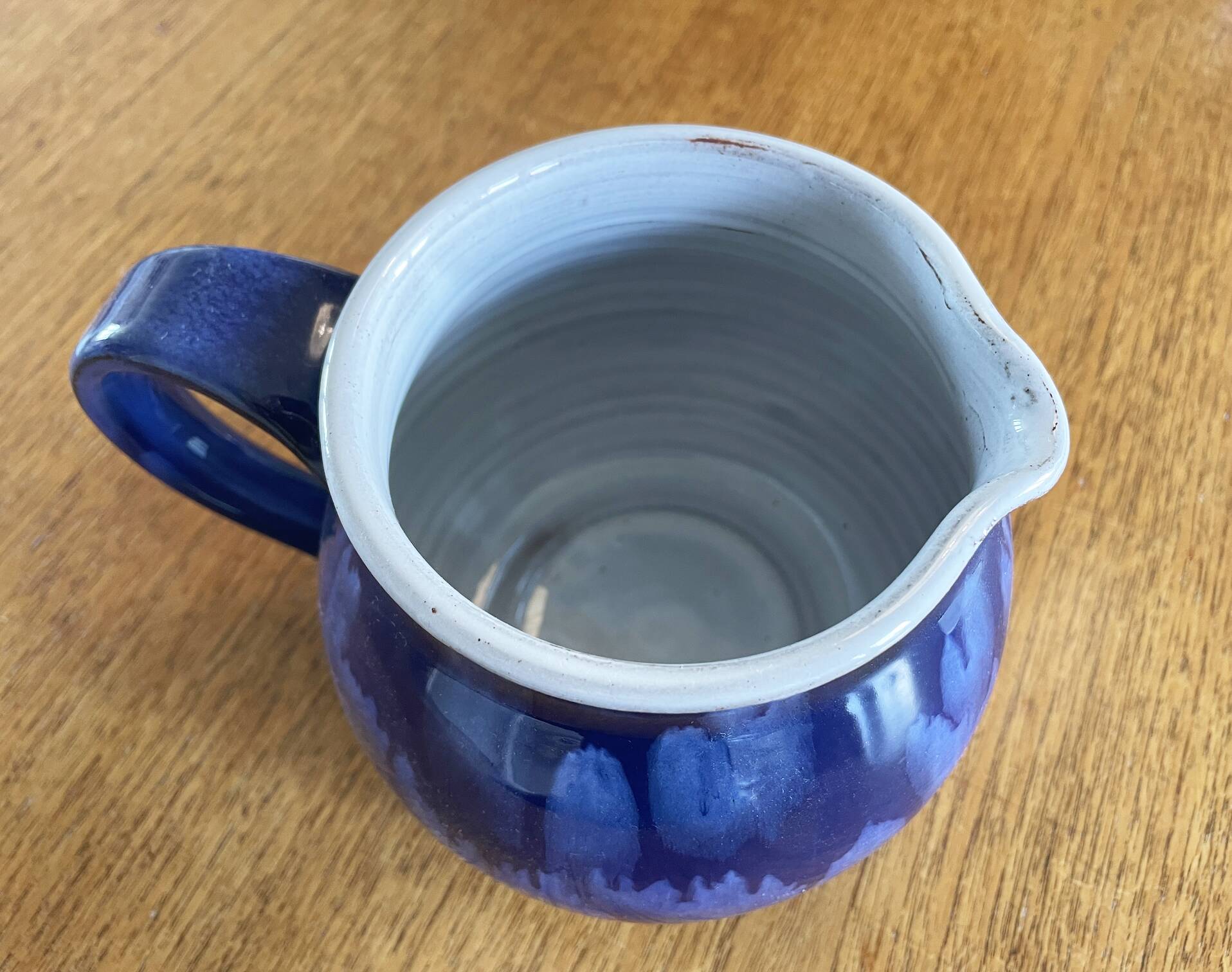 Navy Blue and White German Pitcher Made in Rügen, Drip Glaze Pottery