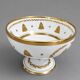 Empire-style footed cup in white porcelain, richly decorated with fine gold.