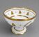 Empire-style footed cup in white porcelain, richly decorated with fine gold.