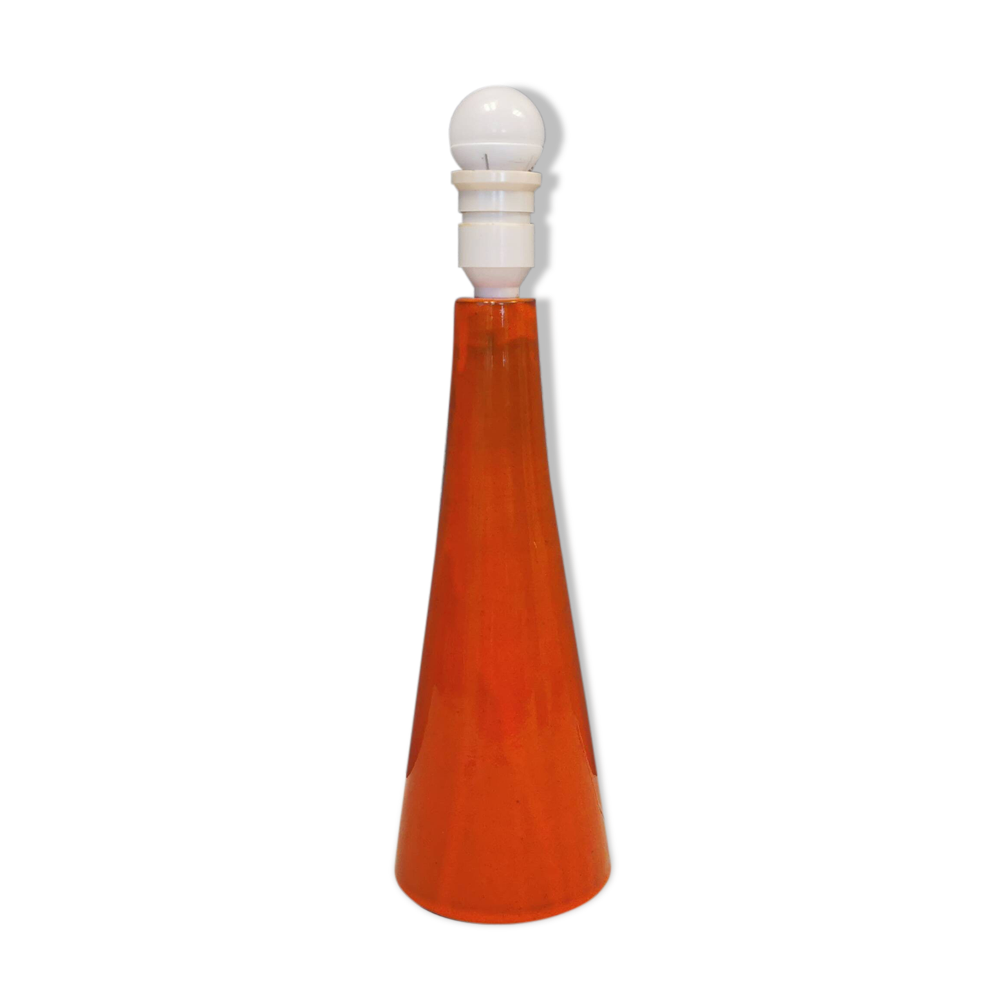 Ceramic table lamp with partial orange glaze.